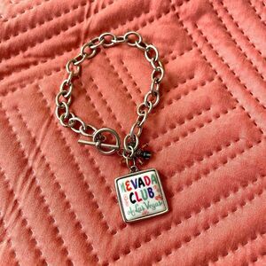 Silver charm bracelet with vintage Las Vegas matchbook charm.